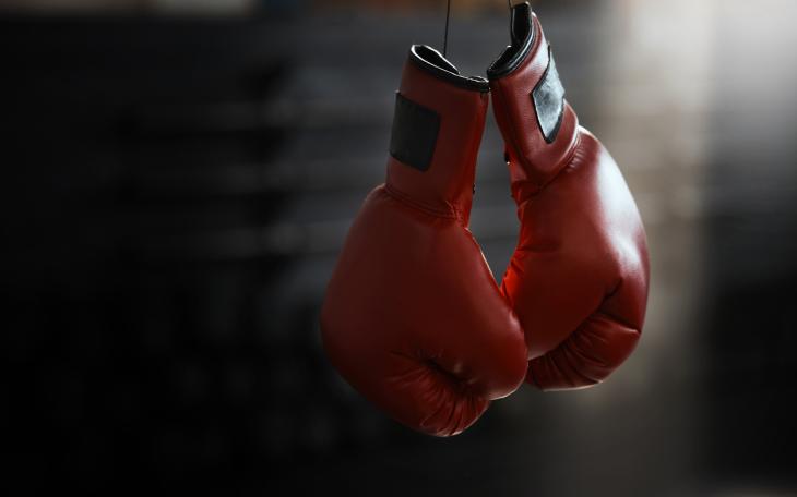 red boxing gloves hanging from the string